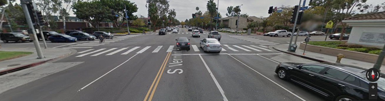 Google Street View of Vermont and Jefferson showing high traffic and three cyclists crossing at the crosswalk